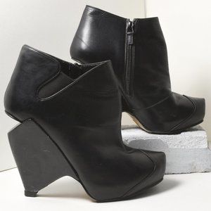 Nicholas Kirkwood black cutout wedge booties